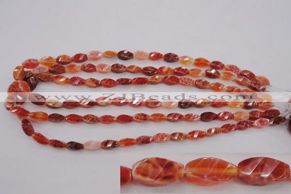 CAG4180 15.5 inches 6*12mm faceted & twisted rice natural fire agate beads